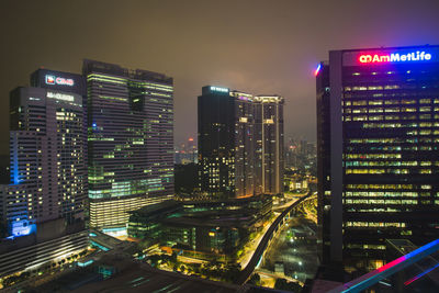 Aerial view of city lit up at night