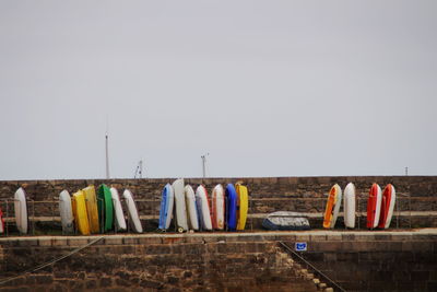 Hooded chairs against clear sky