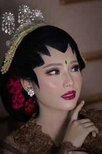 Close-up of young woman with eyes closed