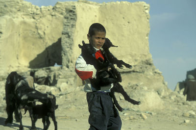 Side view of man standing on rock