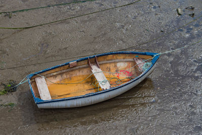 High angle view of abandoned boat moored on shore