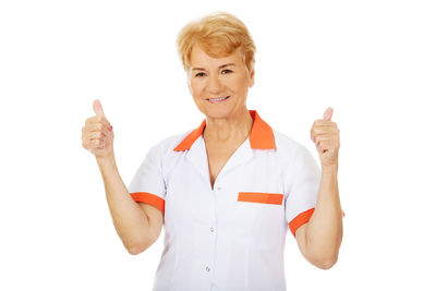 Portrait of a smiling young woman over white background
