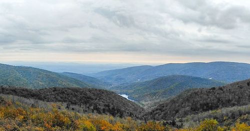 Scenic view of mountains against dramatic sky