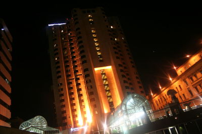 Low angle view of illuminated building at night