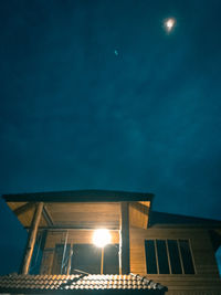 Low angle view of illuminated street light against sky at night