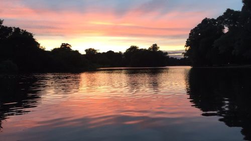 Scenic view of lake against sky during sunset