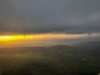 Scenic view of landscape against sky during sunset