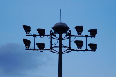 Low angle view of street lights against clear sky