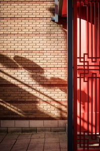 Shadow of railing on wall of building