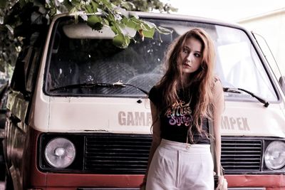 Portrait of young woman in car