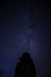 Low angle view of silhouette stars against sky at night