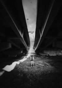 Man walking in illuminated corridor