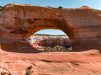 Young man standing in the arches national park in arizona, usa.