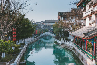 Reflection of buildings and trees in canal