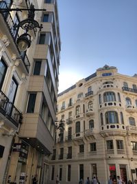 Low angle view of buildings against clear sky