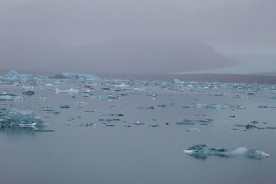 Scenic view of sea against sky during winter