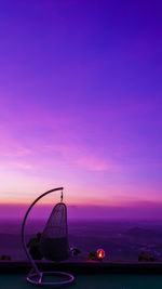 Ferris wheel against sky during sunset