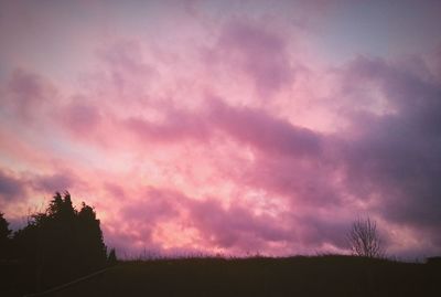 Silhouette of landscape against cloudy sky