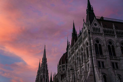 Low angle view of building against sky during sunset