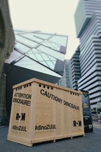 Low angle view of information sign on building in city