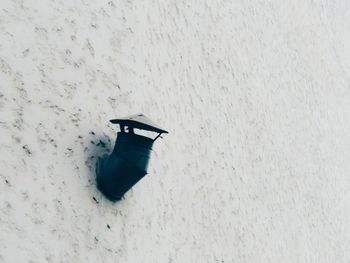 High angle view of snow on land against wall