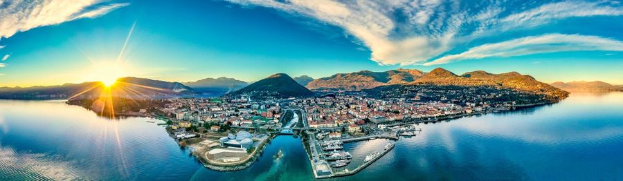 Panoramic view of sea and buildings against sky