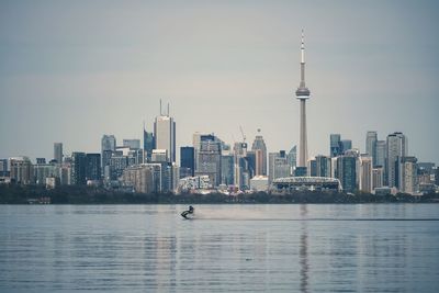 Jet skier in front of toronto skyline 