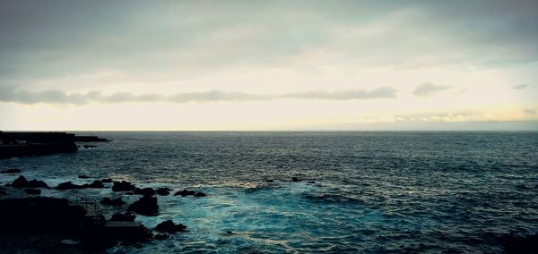 Scenic view of sea at sunset