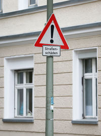 Low angle view of information sign on building