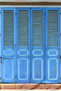 Close-up of closed blue shutter