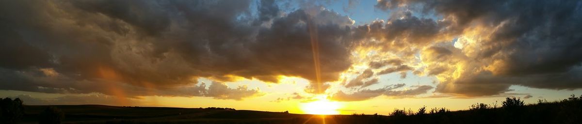 Sun shining through clouds