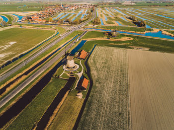 High angle view of windmills in agricultural field