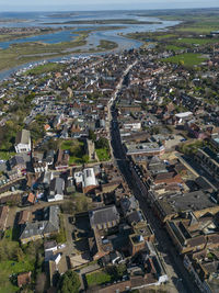 High angle view of townscape by sea