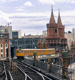 Train at railroad station in city