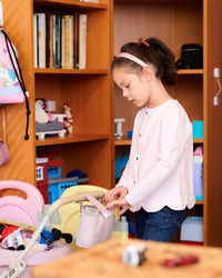 Cute little girl in her play room