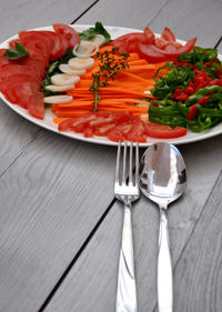 High angle view of vegetables in plate on table