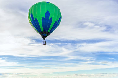 Low angle view of hot air balloon flying in sky