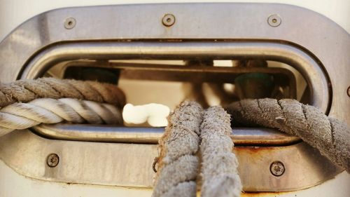 Close-up of rope tied on boat