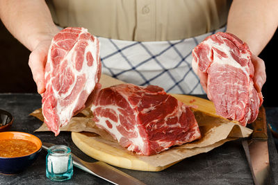 Close-up of person preparing food on table