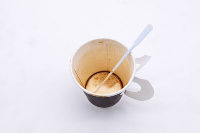 Close-up of coffee cup against white background