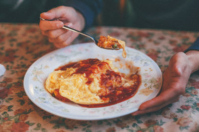 Close-up of man holding food