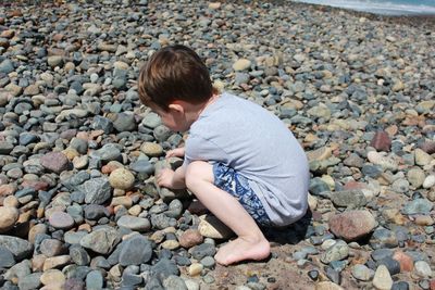 High angle view of boy on rocks