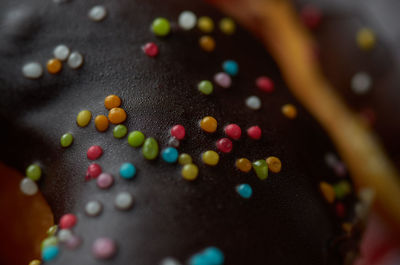 Close-up of multi colored glazed donut 