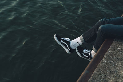 Low section of man sitting on boat