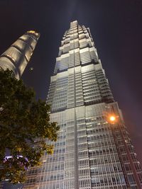 Low angle view of modern buildings at night