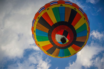 Low angle view of hot air balloon flying against sky