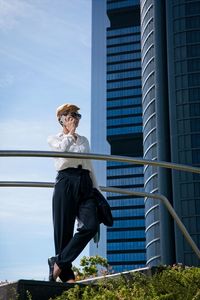 Man looking at city buildings