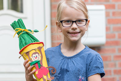 Portrait of girl holding toy