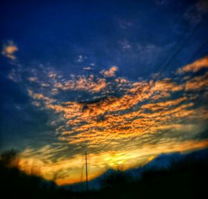 Low angle view of cloudy sky at sunset