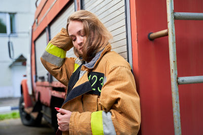 Portrait of young woman using mobile phone